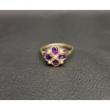 PRETTY AMETHYST AND PEARL CLUSTER RING the five seed pearls interspersed with four oval cut