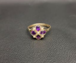 PRETTY AMETHYST AND PEARL CLUSTER RING the five seed pearls interspersed with four oval cut