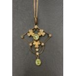 PERIDOT AND SEED PEARL HOLBEIN PENDANT early 20th century, in nine carat gold and on nine carat gold