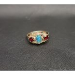 OPAL TRIPLET AND GARNET THREE STONE RING the central opal triplet flanked by horizontally set oval