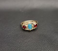 OPAL TRIPLET AND GARNET THREE STONE RING the central opal triplet flanked by horizontally set oval