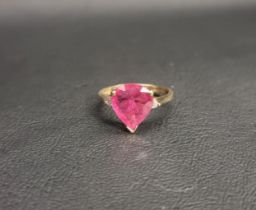 RUBY AND DIAMOND RING the central pear cut ruby measuring approximately 10.5mm x 9.7mm x 3.5mm,