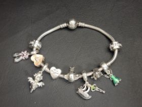 PANDORA MOMENTS SPARKLING MICKEY MOUSE SNAKE CHAIN BRACELET with ten charms including a Disney