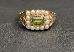 PERIDOT AND PEARL CLUSTER RING the central horizontally set rectangular cut peridot in a fourteen