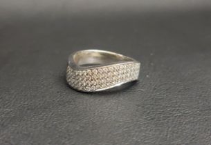 EIGHTEEN CARAT WHITE GOLD DIAMOND RING the stylised band in a wave motif, half of which is set