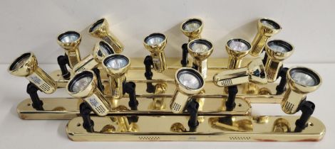 FIVE STRIPS OF BRASS SPOTLIGHTS each with three adjustable lights, each 58cm long (5)