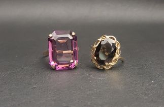 TWO NINE CARAT GOLD MOUNTED DRESS RINGS one set with oval cut smoky quartz in pierced mount, the
