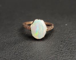 OPAL SINGLE STONE RING the oval cabochon opal measuring approximately 11.2mm x 8.8mm, on unmarked