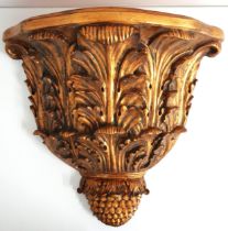 LARGE GILT WALL BRACKET of shaped outline supported by oak leaves and a pineapple finial, 54.5cm