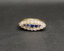 SAPPHIRE AND CLEAR GEM SET DRESS RING the central row of sapphires in clear gem set surround, the