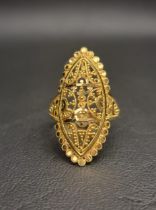 UNMARKED HIGH CARAT GOLD STATEMENT RING the marquise shaped ring with decorative bead and scroll