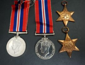 FOUR WWI MEDALS comprising The 1939-1945 Star, The Burma Star and two War Medals1939-45 with ribbons