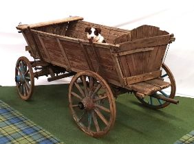 VINTAGE ELM AND OAK UTILITY HORSE CART with four wood and iron banded wheels and a pivoting front