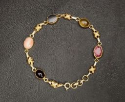 TWENTY-ONE CARAT GOLD BRACELET the five cabochon gemstones alternating with six floral motif chain