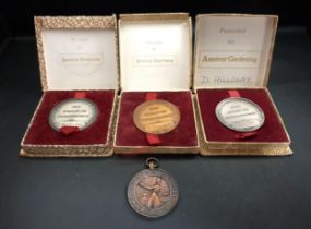 THREE BOXED GARDENING MEDALS awarded to D.Hillcoat 'For Merit In Horticulture' and a 'Woman's Own