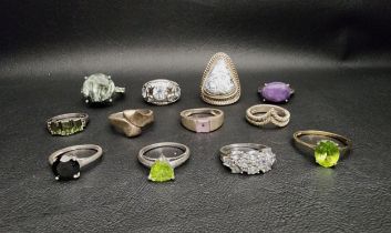 SELECTION OF TWELVE SILVER RINGS including a blue topaz cluster ring, and various other gem and