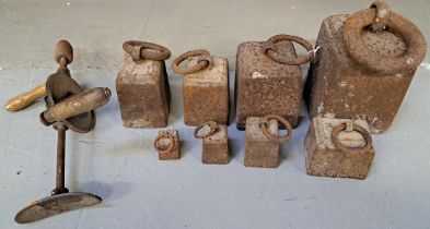 EIGHT VINTAGE IRON WEIGHTS each with a ring handle, together with a vintage hand drill