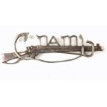 Cumann na mBan. A white metal Cumann na mBan cap- or lapel-badge, in the form of a Lee Enfield