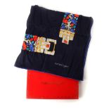 Must de Cartier silk scarf, a navy silk scarf bordered with a turquoise, blue and red pattern,