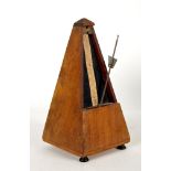 French metronome by Maelzel, the pyramidical hardwood case with gilt label. 9" (23cm) high.