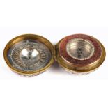 An oriental silver-cased combination compass and sundial, the compass with engraved copper bezel