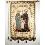 A 19th century processional banner venerating the Holy Family. A cream watered silk banner, enclosed