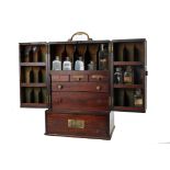 Campaign apothecary chest. A George III mahogany chest, the top with brass carrying handle above