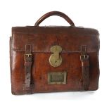 Dublin Castle, official's attache case. A brown leather case, the flap with brass lock and with