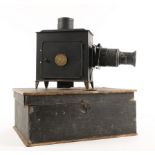 A late 19th century German tin and brass magic lantern with slides.