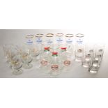 A collection of 1970s and 1980s pub glassware to include 6 Guinness half pint glasses, 6 Harp half