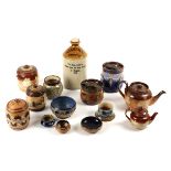 A collection of Royal Doulton stoneware tobacco jars and two teapots, also a Pickup & Co. Bristol