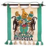 Rhodesian banner suspended on a hardwood pole, of, depicting the Arms of Rhodesia. 'Sit Nomine