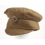 Early 20th century Irish Army other-ranks uniform cap. The bull-wool, peaked cap with Oglaigh na