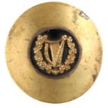 Irish Volunteers / Na Fianna Éireann, piper's cloak pin. A convex brass plate centred by a harp in a