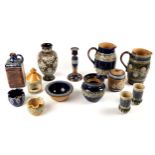 Doulton Lambeth. A collection of Doulton Lambeth ware including two large water jugs, a candlestick,