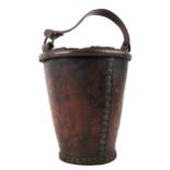 A 19th century leather fire bucket, the seam and base with copper rivets, 20" high, including