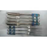 Archibald Knox for Liberty & Co - seven silver and blue green enamel, pastry and fruit forks with