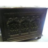 Arts & Crafts carved oak coffer with iron work hinges and ring handles panel to top and sides.