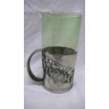 Archibald Knox for Liberty & Co. English Pewter hot milk holder having a green enamel glass liner