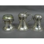 Omar Ramsden - A silver cruet set comprising of mustard pot with hinged domed cover and reeded