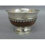 Omar Ramsden - A silver mounted and walnut Mazar Bowl of circular form with flared rim decoration