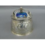 Omar Ramsden & Alwyn C.E. Carr - A chased silver and blue enamel topped box with crown style top,