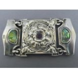 Omar Ramsden and Alwyn C.E. Carr - Silver belt buckle with flower decoration to centre inset with