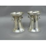 Omar Ramsden - A pair of capstan shaped silver salts with flared bodies rope twist and pierced berry