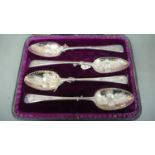 A set of four GIII silver Berry serving spoons cased - 7 ozt