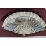 A large carved ebonized wooden fan by J. Duvelleroy, London & Paris boxed plus two bone and