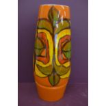 Large Poole cylindrical pottery vase, orange, yellow, red, green and black abstract design on an