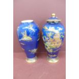 Pair of Carlton ware baluster shaped pottery vases with chinoiserie decoration on a dark blue ground