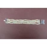 Quadruple cultured pearl bracelet with 18ct white gold and sapphire clasp - length 7.5ins