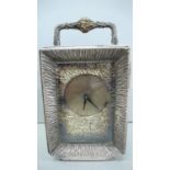 Stuart Devlin heavy silver carriage clock with flower and leaf decration to handle, leaf